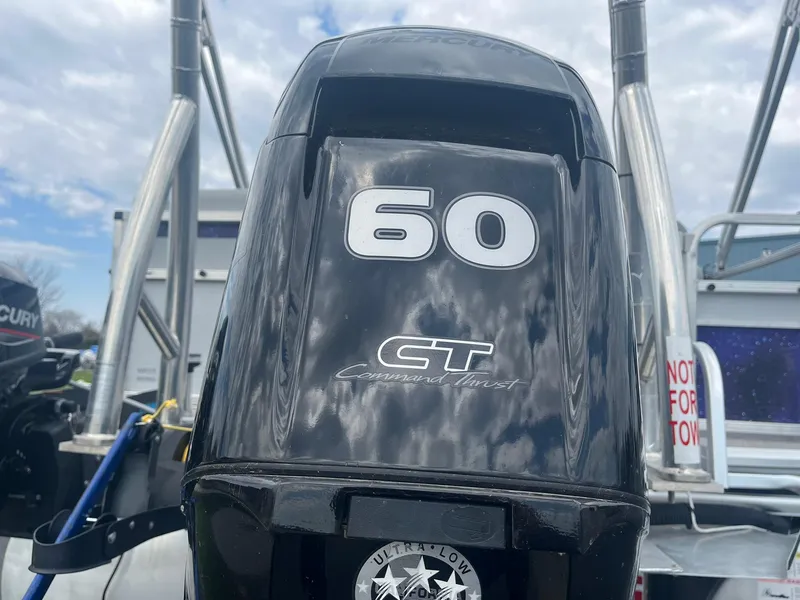 Slide: The Image of Outboard motor on 2019 Lowe Ultra 182 Fish & Cruise boat, cloudy sky background. - 27