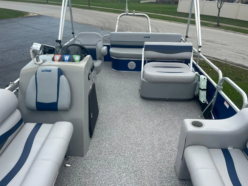 Slide: The Image of 2019 Lowe Ultra 182 Fish & Cruise pontoon boat with spacious seating and modern design. - 9