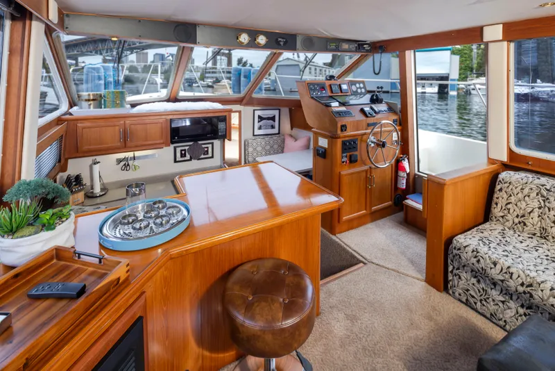 Slide: The Image of Interior of 1995 Tollycraft 45 CPMY yacht with wooden furnishings and helm station. - 20
