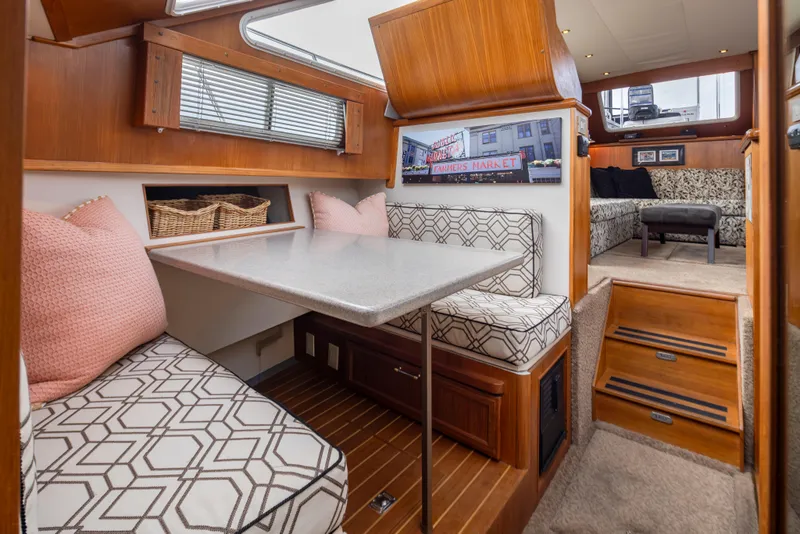 Slide: The Image of Interior of 1995 Tollycraft 45 CPMY yacht with cozy dining area and stylish decor. - 23
