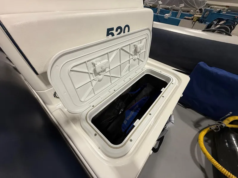 Slide: The Image of Open storage compartment on 2017 Williams Jet Tenders Sportjet 520 boat. - 14