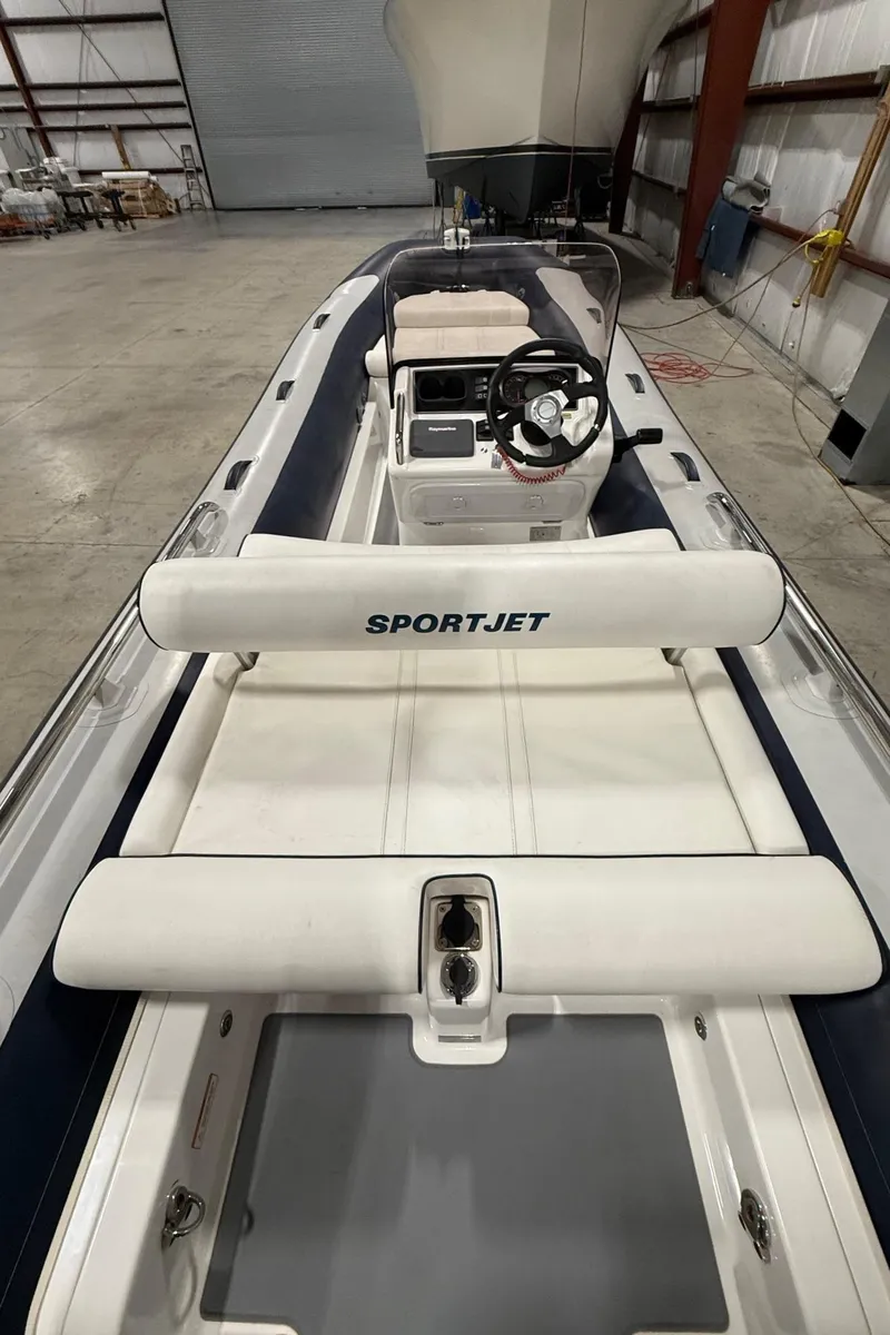 Slide: The Image of 2017 Williams Jet Tenders Sportjet 520 in a warehouse setting. - 16