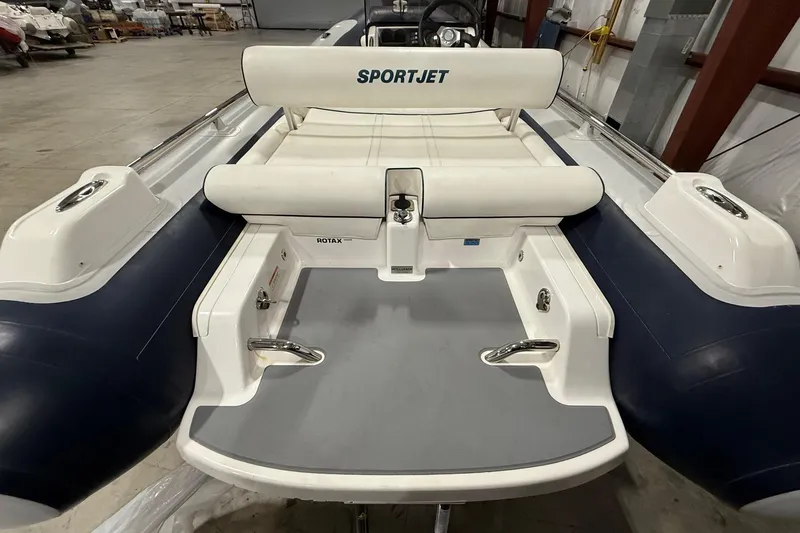 Slide: The Image of 2017 Williams Jet Tenders Sportjet 520, rear view in a storage facility. - 19
