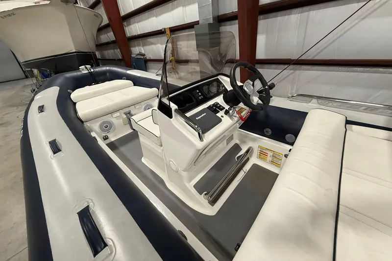 Slide: The Image of 2017 Williams Jet Tenders Sportjet 520 interior with steering console and seating. - 6