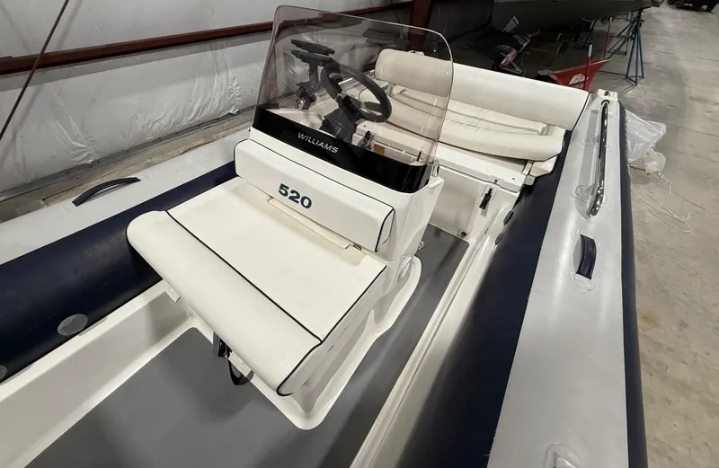 Slide: The Image of 2017 Williams Jet Tenders Sportjet 520 with white seating and steering console. - 9