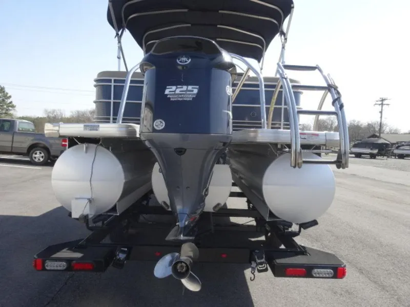 Slide: The Image of 2014 Sanpan SP 2500 DL pontoon boat with 225 horsepower engine, rear view. - 3
