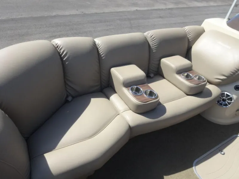 Slide: The Image of 2014 Sanpan SP 2500 DL boat seating with cup holders and beige upholstery. - 4