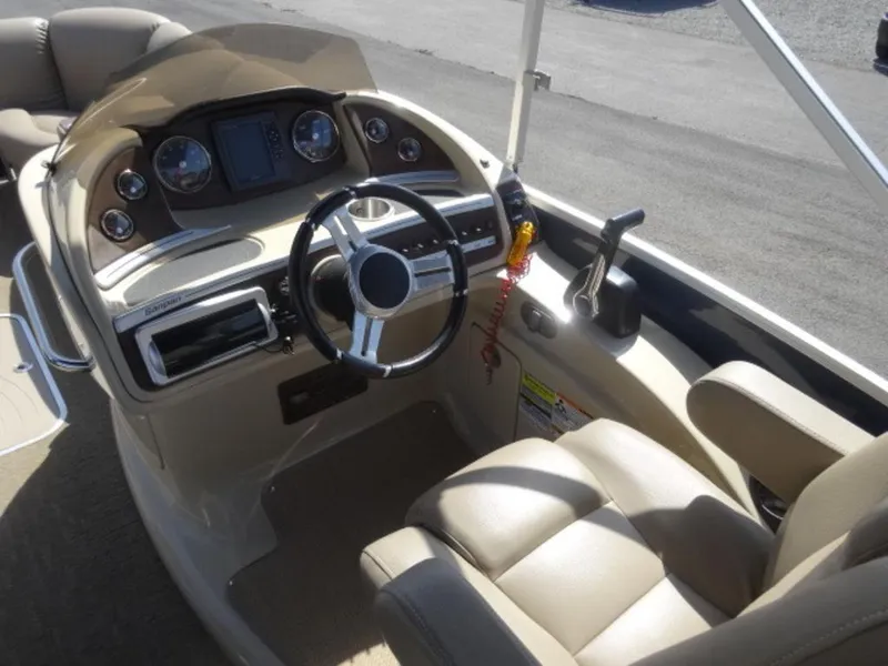 Slide: The Image of 2014 Sanpan SP 2500 DL boat dashboard with steering wheel and controls. - 6