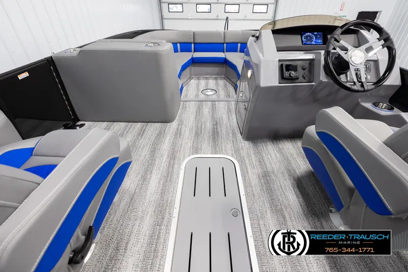 Slide: The Image of 2025 Bennington 25 LTSBSE boat interior with modern seating and steering console. - 16