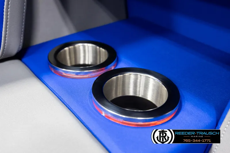 Slide: The Image of Cup holders in 2025 Bennington 25 LTSBSE boat with blue interior accents. - 35