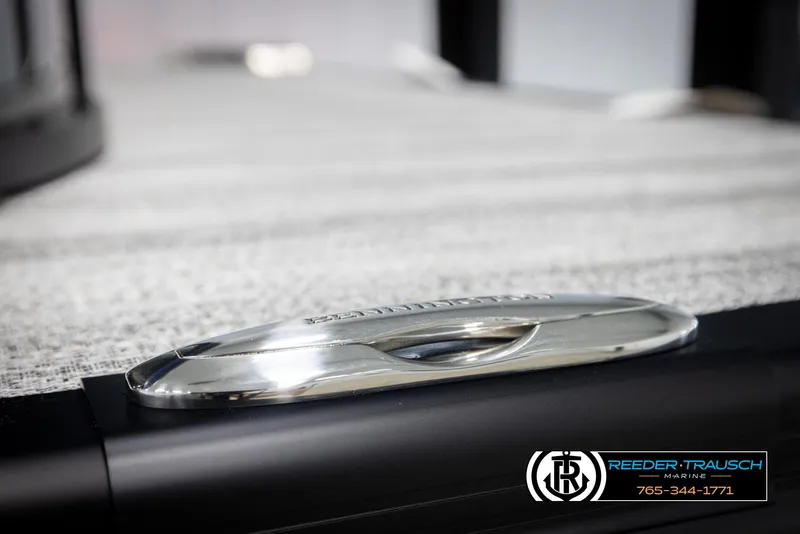 Slide: The Image of 2025 Bennington 25 LTSBSE boat detail with sleek metallic design and Reeder-Trausch Marine logo. - 43