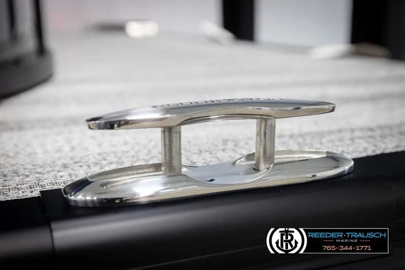 Slide: The Image of 2025 Bennington 25 LTSBSE boat cleat, close-up view, Reeder-Trausch Marine branding. - 44