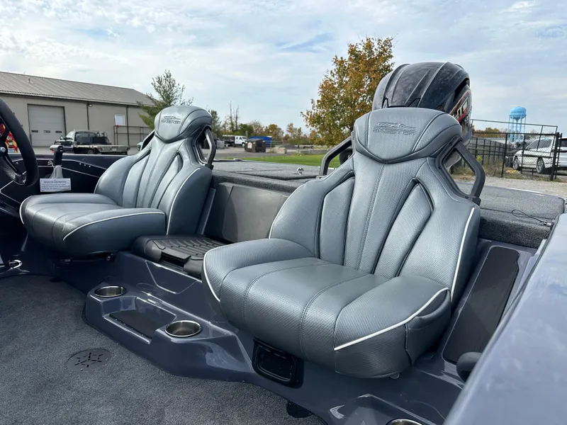 Slide: The Image of 2024 Skeeter ZXR19 boat interior with two gray seats and cup holders. - 10