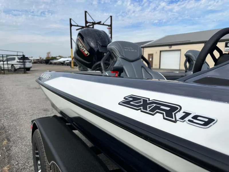 Slide: The Image of 2024 Skeeter ZXR19 boat with Yamaha engine, parked outdoors on a trailer. - 17