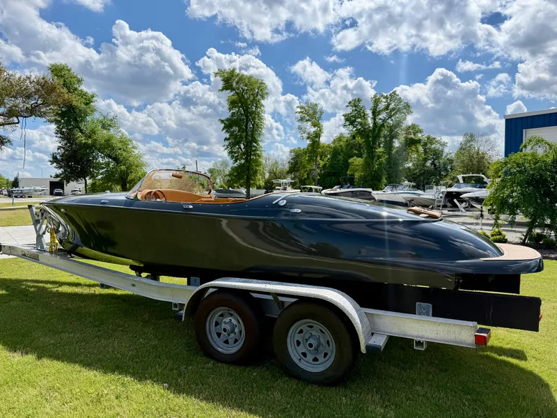 Slide: The Image of 2019 Seven Seas Yachts Hermes Speedster on trailer, parked on grass under a cloudy sky. - 10