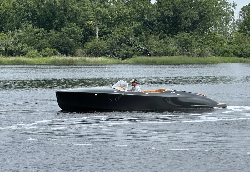 Slide: The Image of 2019 Seven Seas Yachts Hermes Speedster cruising on a calm river with lush greenery. - 4