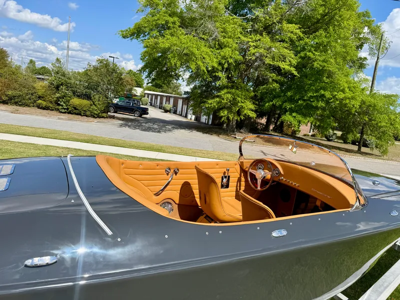 Slide: The Image of 2019 Seven Seas Yachts Hermes Speedster with tan interior, parked outdoors on a sunny day. - 8