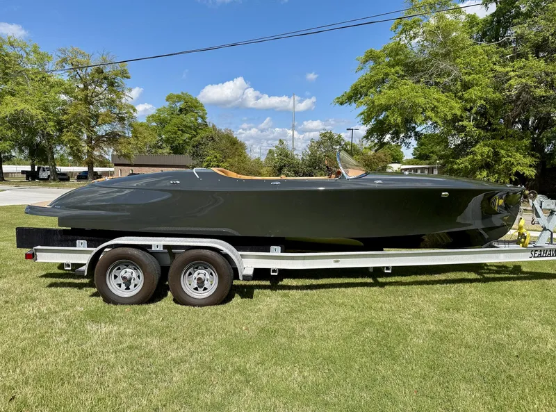 Slide: The Image of 2019 Seven Seas Yachts Hermes Speedster on trailer, parked on grass under a clear sky. - 9