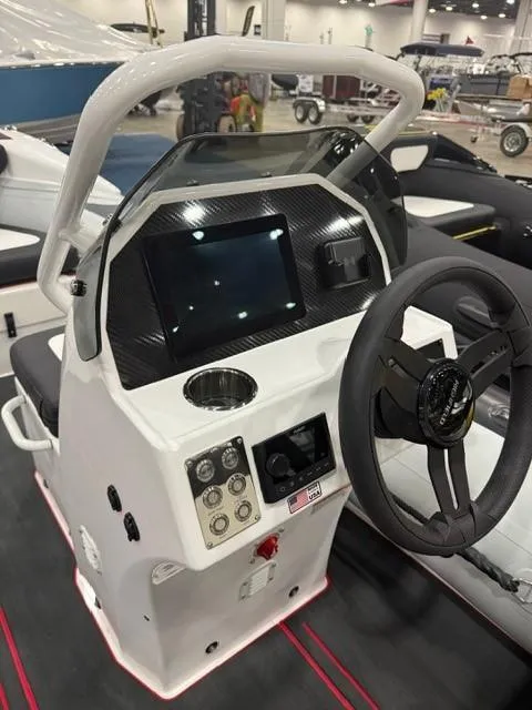 Slide: The Image of 2025 Highfield Velox 420 boat dashboard with steering wheel and control panel. - 10