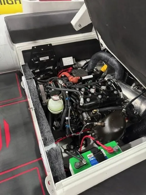 Slide: The Image of 2025 Highfield Velox 420 engine compartment with visible components and battery. - 12