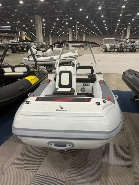 Slide: The Image of 2025 Highfield Velox 420 inflatable boat displayed at an indoor exhibition. - 9