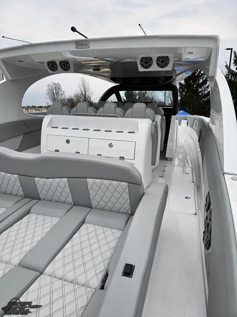 Slide: The Image of 2023 Mystic Powerboats M5200 interior with luxurious seating and modern design. - 25