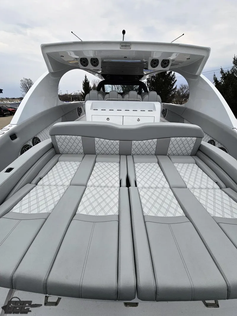 Slide: The Image of 2023 Mystic Powerboats M5200 with luxurious seating and sleek design. - 26