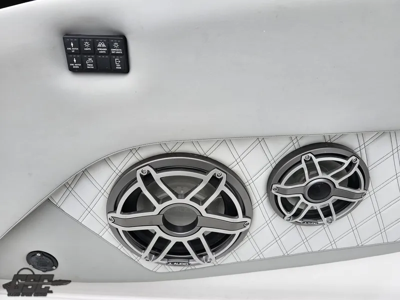 Slide: The Image of 2023 Mystic Powerboats M5200 interior with premium audio speakers and control panel. - 30