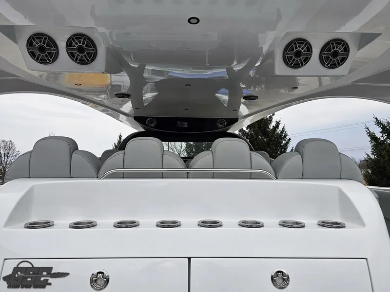 Slide: The Image of 2023 Mystic Powerboats M5200 interior with sleek seating and modern design elements. - 31