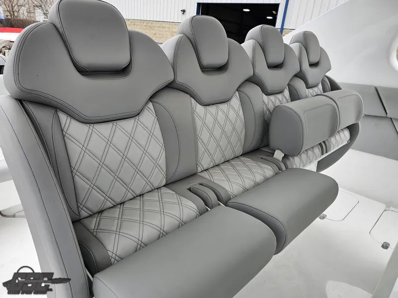 Slide: The Image of Gray leather seating in 2023 Mystic Powerboats M5200, featuring diamond stitching and ergonomic design. - 35