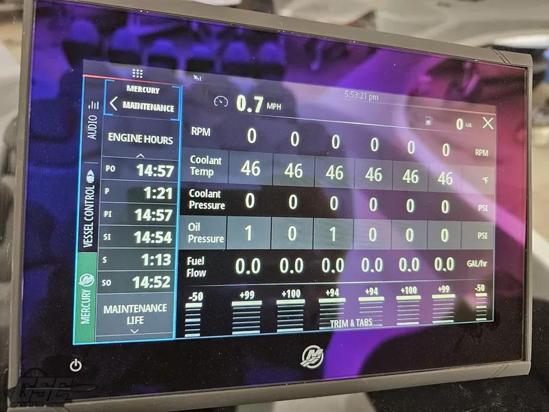 Slide: The Image of Dashboard display of 2023 Mystic Powerboats M5200 showing engine metrics and maintenance data. - 37