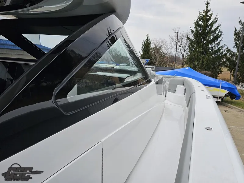 Slide: The Image of 2023 Mystic Powerboats M5200, sleek design, side view, modern luxury yacht. - 41