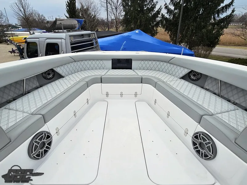 Slide: The Image of 2023 Mystic Powerboats M5200 interior with luxurious seating and modern design. - 43