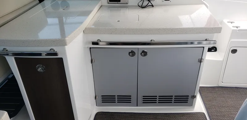 Slide: The Image of 2016 Monterey 360 Sport Coupe interior with sleek cabinetry and modern countertop design. - 11