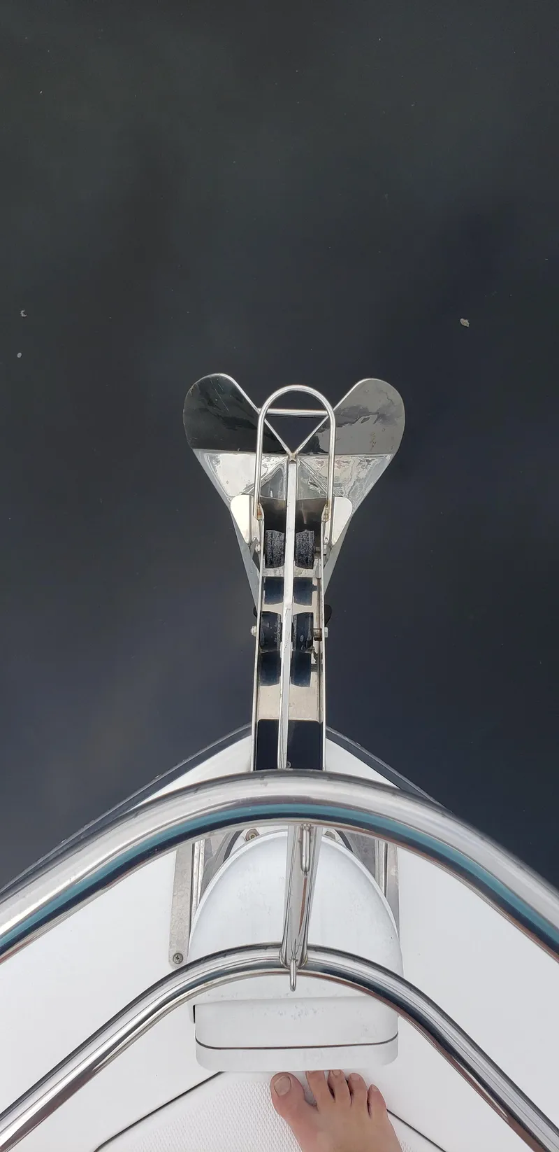 Slide: The Image of 2016 Monterey 360 Sport Coupe anchor and bow detail on calm water. - 19