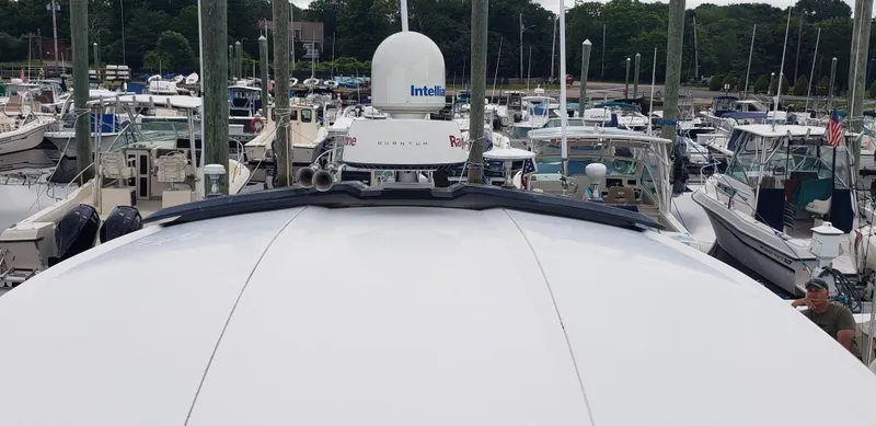 Slide: The Image of 2016 Monterey 360 Sport Coupe docked among various boats in a marina. - 20