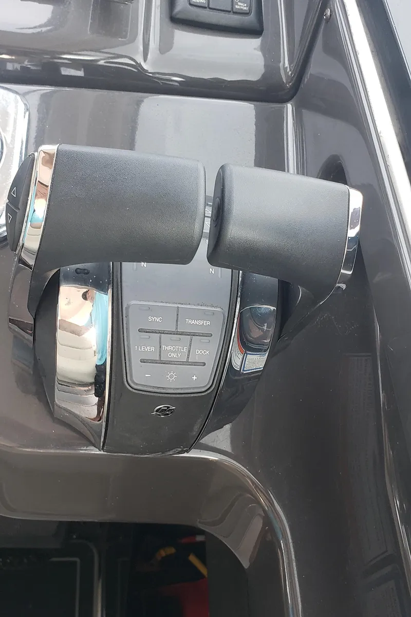 Slide: The Image of Throttle controls of a 2016 Monterey 360 Sport Coupe boat. - 25