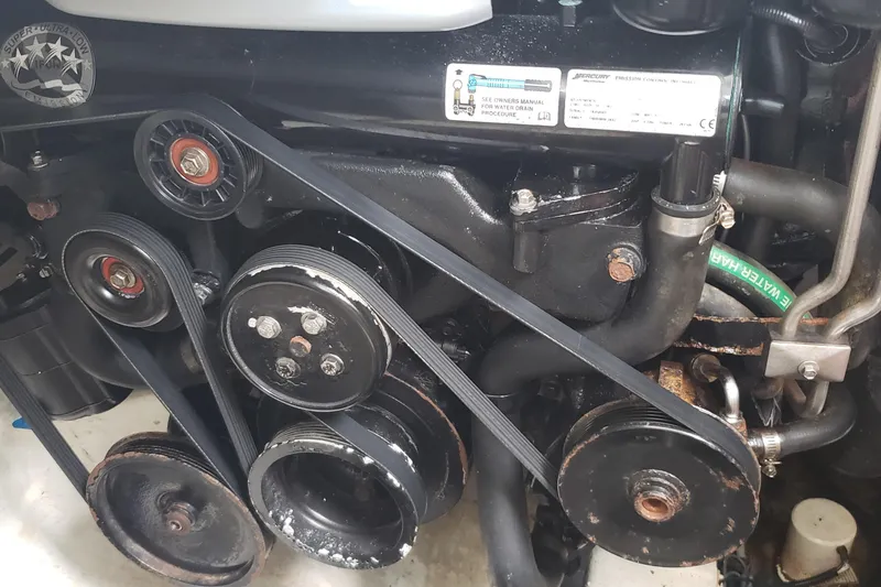 Slide: The Image of Engine components of a 2016 Monterey 360 Sport Coupe, featuring belts and pulleys. - 38