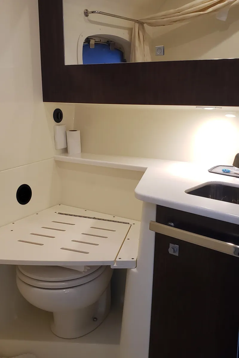 Slide: The Image of 2016 Monterey 360 Sport Coupe bathroom with toilet, sink, and mirror. - 39