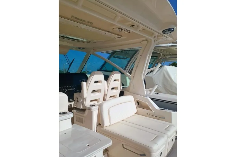 Slide: The Image of 2025 Grady-White Freedom 345 boat interior with luxurious seating and modern design. - 15
