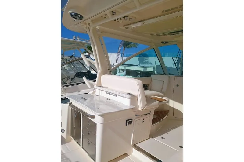 Slide: The Image of 2025 Grady-White Freedom 345 boat interior with seating and storage, showcasing luxury design. - 16