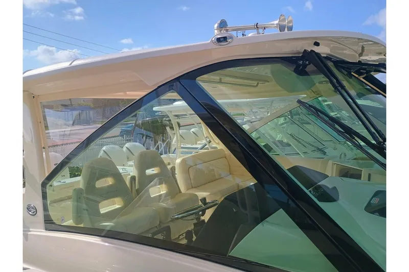 Slide: The Image of 2025 Grady-White Freedom 345 boat interior with seating, viewed through the windshield. - 4