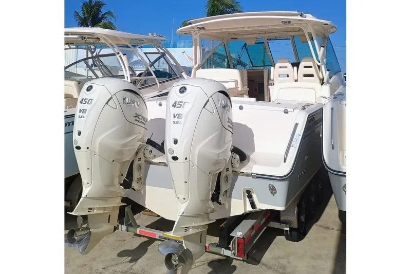 Slide: The Image of 2025 Grady-White Freedom 345 boat with dual Yamaha 450 V8 engines on a trailer. - 6