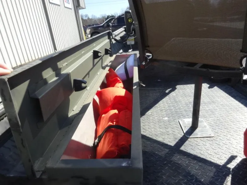 Slide: The Image of Open storage compartment on 2014 War Eagle 1542 boat with orange life jackets inside. - 10