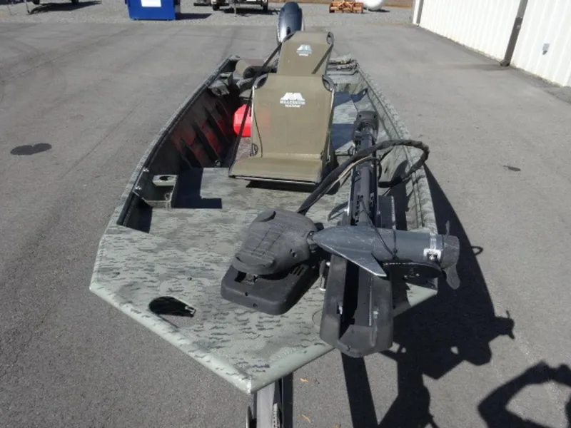 Slide: The Image of 2014 War Eagle 1542 boat with camouflage design and mounted equipment on a trailer. - 14