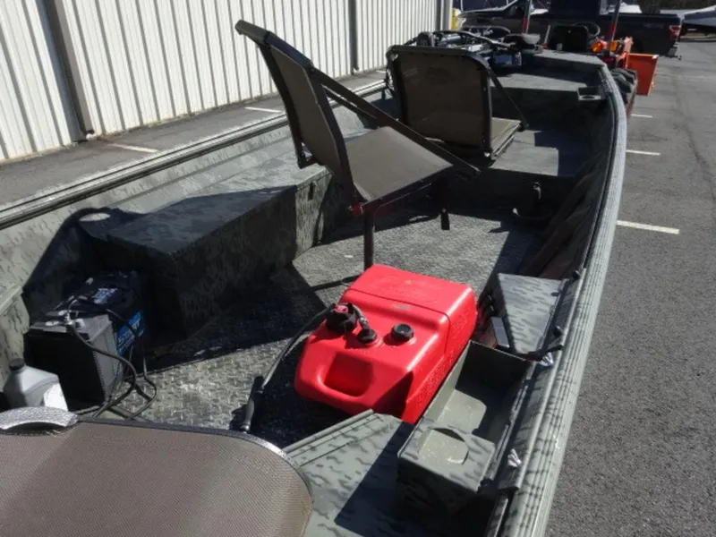 Slide: The Image of 2014 War Eagle 1542 boat interior with seating and red fuel tank. - 6