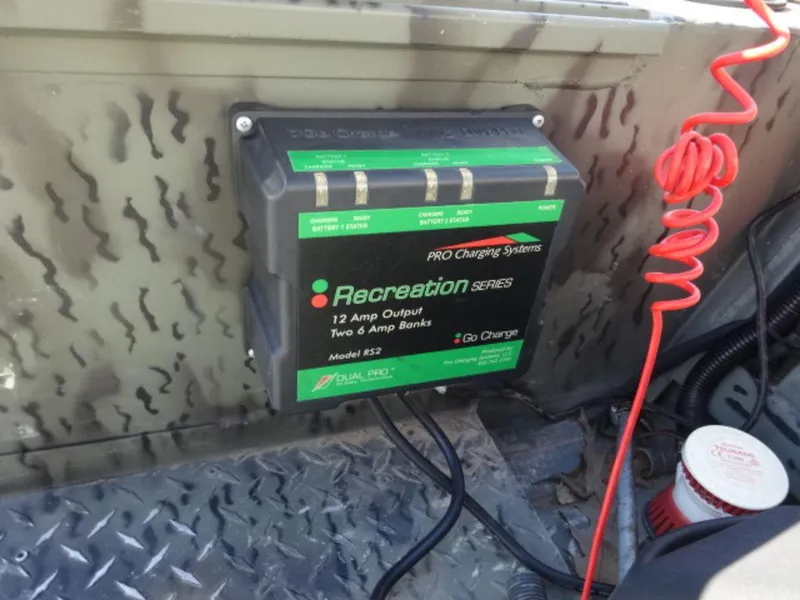 Slide: The Image of Battery charger in a 2014 War Eagle 1542 boat, featuring a Recreation Series Pro Charging System. - 8