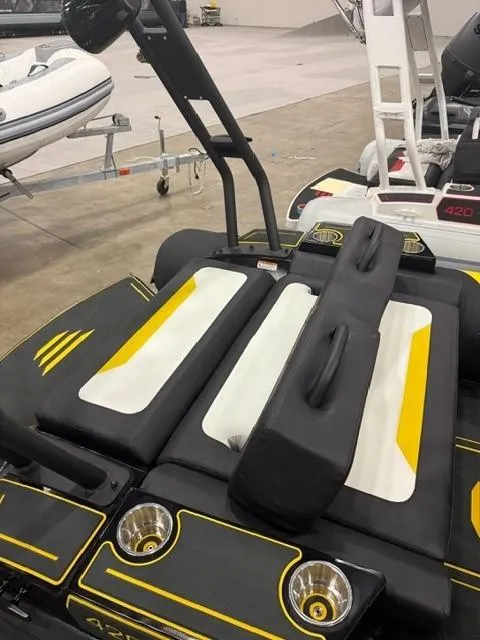 Slide: The Image of 2025 Highfield Velox 420 boat interior with black and yellow seating, showcasing modern design. - 13
