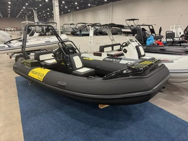 Slide: The Image of 2025 Highfield Velox 420 inflatable boat displayed indoors on blue carpet. - 6