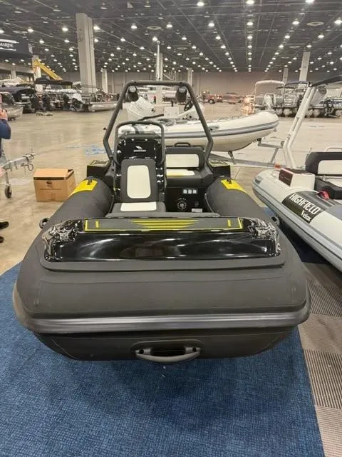Slide: The Image of 2025 Highfield Velox 420 inflatable boat displayed indoors at a boat show. - 7